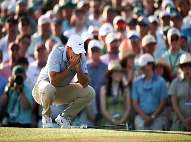 Rory McIlroy celebrates on the 18th green after winning back-to-back Masters titles at Augusta National