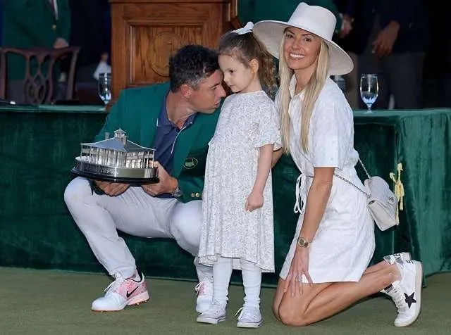 Rory McIlroy celebrates on the 18th green after winning back-to-back Masters titles at Augusta National